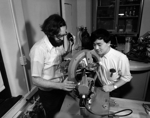 Larry Finger and Y. Ohashi aligning a crystal on the four-circle X-ray diffractometer in preparation for determining its structure