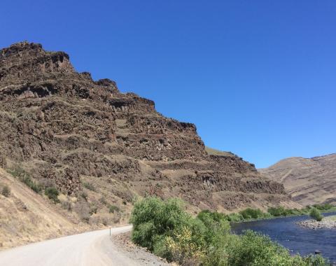 This pile of lava flows is part of the Grande Ronde Basalt, the most voluminous formation of the Columbia River Basalt Group (Photo credit: Jennifer Kasbohm).