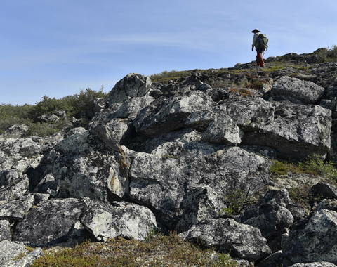 A researcher conducting fieldwork at the Slave Craton, Canada