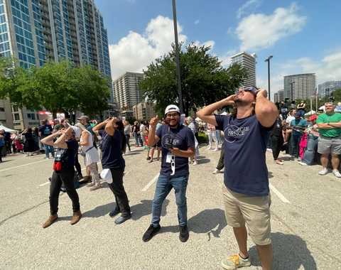 Carnegie science postdocs and volunteers look at the eclipse