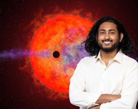 Shreyas Vissapragada in front of an artist's conception of a planet passing in front of a red dwarf star. The illustration was created by NASA, ESA, and Joseph Olmsted (STScI)