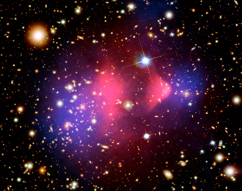Image credit: The Bullet Cluster X-ray: NASA/CXC/M. Markevitch et al.; Optical: NASA/STScI; Magellan/U. Arizona/D. Clowe et al.; Lensing Map: NASA/STScI; ESO WFI; Magellan/U. Arizona/D. Clowe et al.