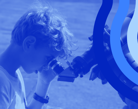 Observatories Open House boy looks into solar telescope with blue visual styling elements