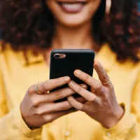 A woman checks her cell phone