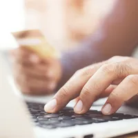 Man typing on computer keyboard