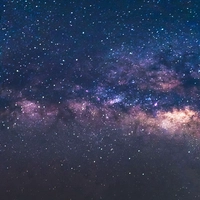 The Milky Way is visible in a starry sky. 
