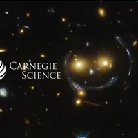 Gravitational lens showing large arcs of background galaxies.