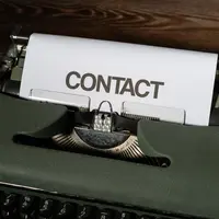Typewriter with words contact
