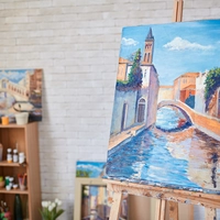 Paintings in a studio on easels