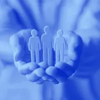 hands holding wooden people - blue 