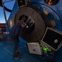 Laird Close, Magellan Adaptive Optics principal investigator, observes Alpha Centauri as the adaptive optics system corrects the image on the 6.5-meter Clay telescope. 