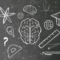 Blackboard with drawings of an atom, a brain, a calculator, a graduation cap, and other scholastic items