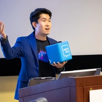 Mike Wong moderates Q&A at Neighborhood Lecture featuring NASA’s Caleb Scharf. In 2025, Wong and Scharf received a $5 million, five-year grant to develop A.I. tools for enhancing the search for signs of life on other planets.