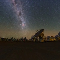 The Milky Way glitters above the ALMA array in this image taken from a time lapse sequence during the ESO Ultra HD Expedition.  Credit: ESO/B. Tafreshi (twanight.org)