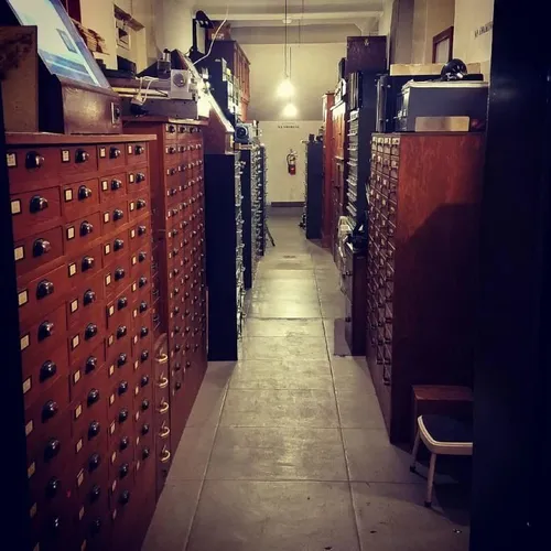 Photo of a hallway with tall file cabinets going all the way down on both sides