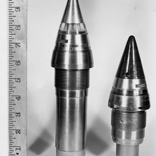 A proximity fuze at the left compared with a clockwork fuze at right