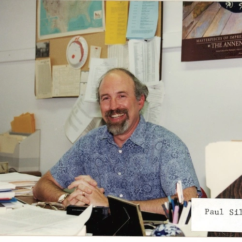 The late Paul Silver smiles from behind his desk at the Carnegie Institution for Science Broad Branch Road Campus. The Carnegie Institution for Science recently introduced a new named postdoctoral fellowship in his honor. Image courtesy of Carnegie Institution for Science.