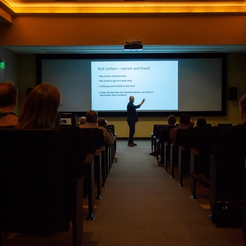 Graham Pearson in front of slide