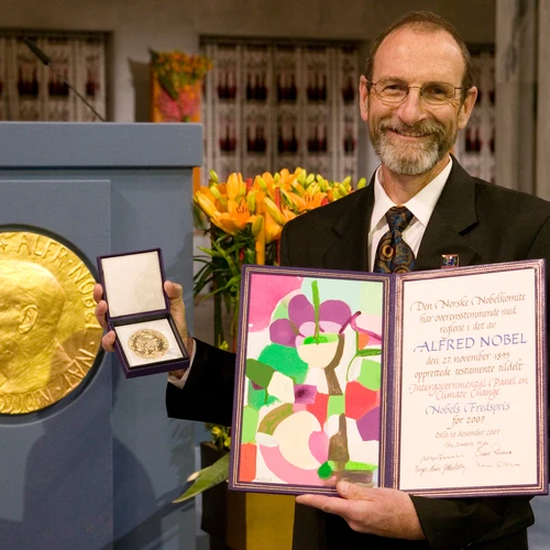 Carnegie's Chris Field poses with the 2007 Nobel Peace Prize awarded to the IPCC.