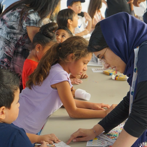 Young Open House attendees participate in an activity