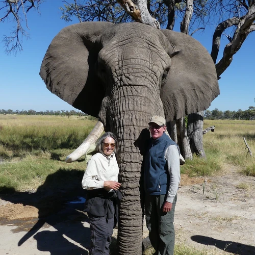 Sigrid Burton and Max Brennan pose with an elephant