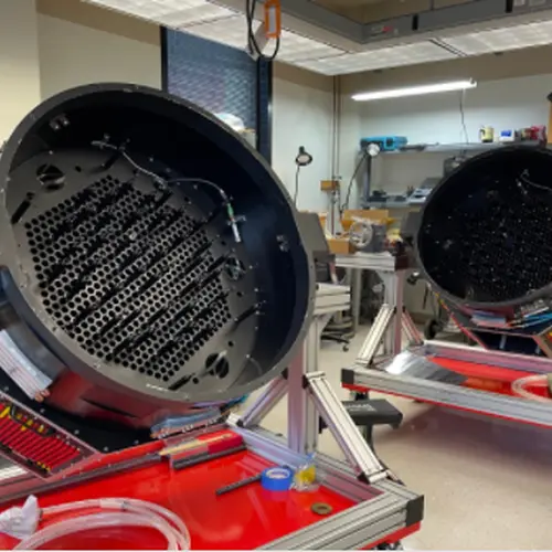 The twin FPS units (prior to robot installation). One of these goes to Carnegie's Las Campanas Observatory in the Southern Hemisphere and the other goes to Apache Point Observatory in the Northern hemisphere. Credit: The SDSS collaboration.