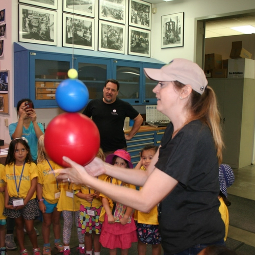 A group dedicated to advancing girls in STEM fields tours the Observatories machine shop.