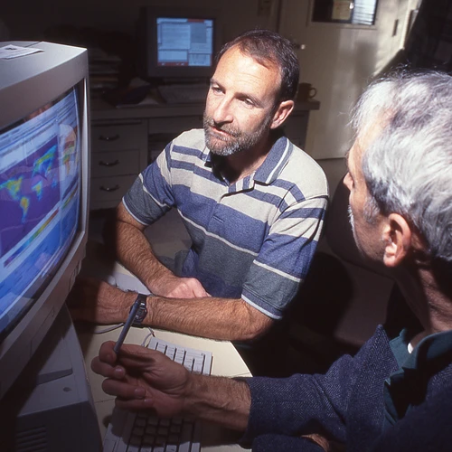 Chris Field and Joe Berry work at the computer