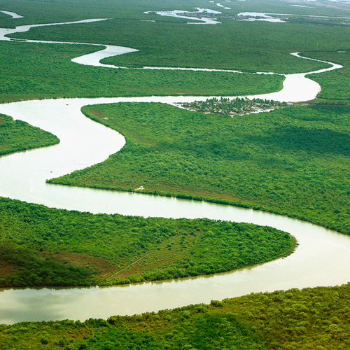 A river in India winds through green countryside as seen from overhead. Purchased from Shutterstock. 