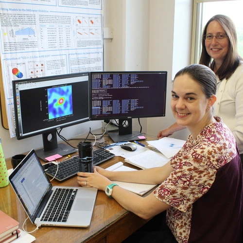 Meredith MacGregor and Alycia Weinberger working on campus. 