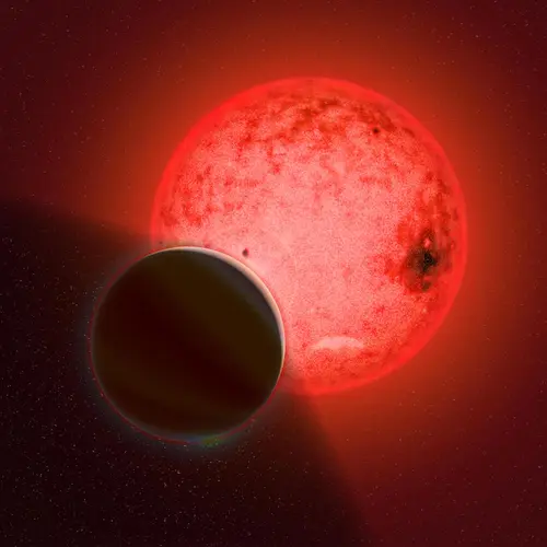 Artist's conception of a large gas giant planet orbiting a small red dwarf star called TOI-5205. Image by Katherine Cain, courtesy of the Carnegie Institution for Science. 
