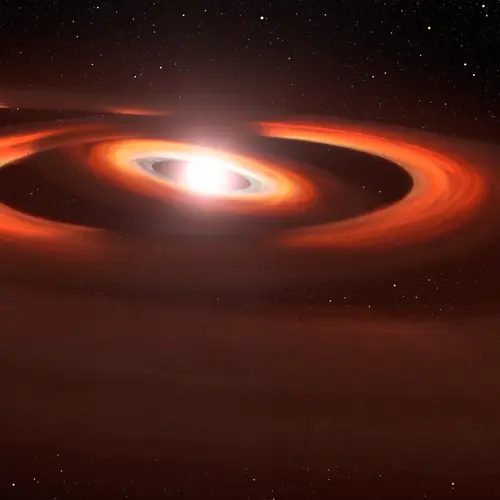 This artist's concept is based on Hubble Space Telescope images of gas-and-dust disks around the young star TW Hydrae. Hubble Space Telescope photos show shadows sweeping across the disks encircling the system. Credit: NASA, AURA/STScI for ESA, Leah Hustak (STScI).