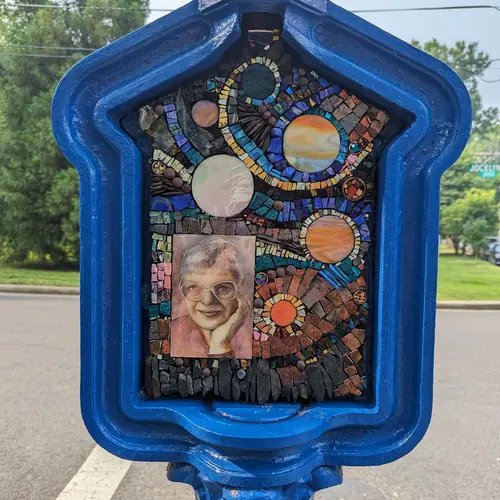 Call Box Art - Brightly colored mosaic with space themes and a portrait of Vera Rubin
