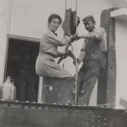 Phoebe Waterman Haas using a bucket lift to ascend the 150-foot solar tower at Mount Wilson Observatory