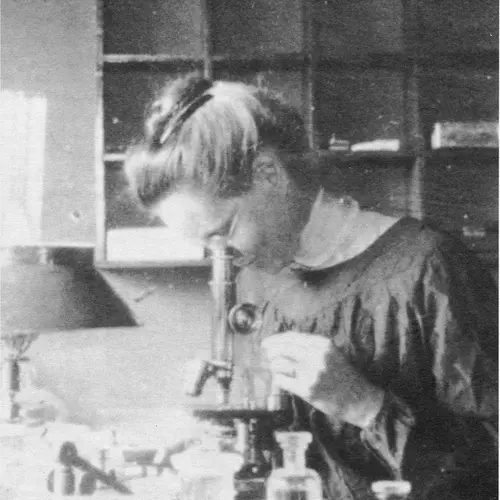 Nettie Marie Stevens is shown here looking through a microscope while studying at the Stazione Zoologica in Naples, Italy. 
