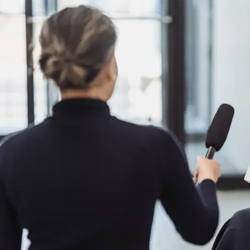 Reporter holding Microphone