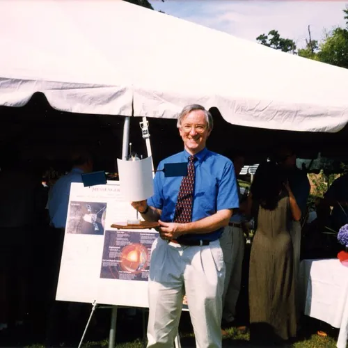 Sean Solomon with a model of the MESSENGER craft, 1999