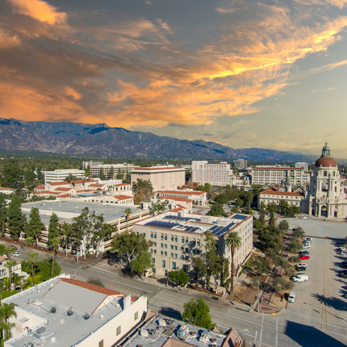 Downtown Pasadena aerial view with golden sky lit up by setting sun