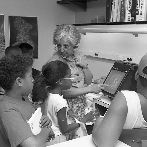 Maxine Singer talks to First Light students during a fieldtrip to a lab