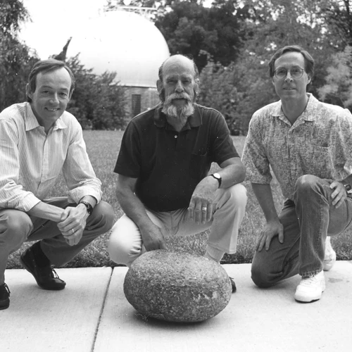 Steven Shirey, Joe Boyd and Richard Carlson pose behind this unusually large xenolith