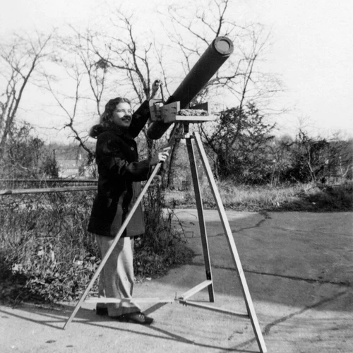 Vera Rubin as a Child Peers THrough Telescope