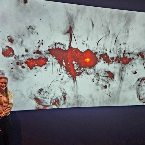 Allison Matthews with the image from the MeerKAT radio telescope.