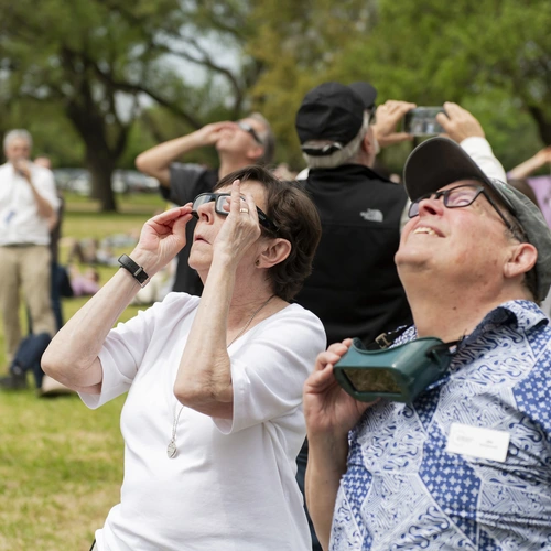 Carnegie Champions Cynthia Kurtz and Jim McDermott observe the 2024 Great North American Eclipse in Dallas, TX