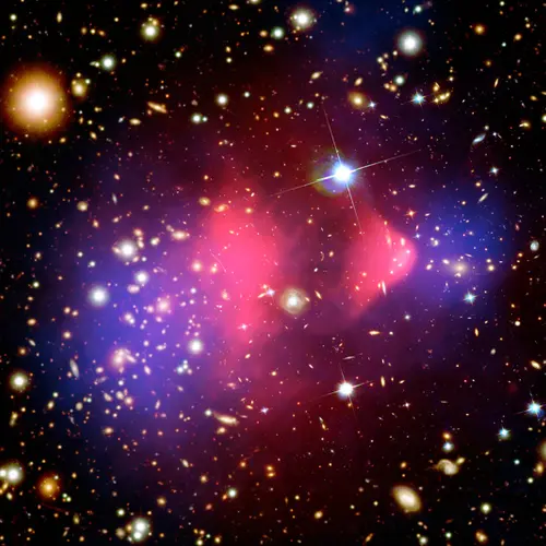 Image credit: The Bullet Cluster X-ray: NASA/CXC/M. Markevitch et al.; Optical: NASA/STScI; Magellan/U. Arizona/D. Clowe et al.; Lensing Map: NASA/STScI; ESO WFI; Magellan/U. Arizona/D. Clowe et al.