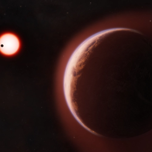 In this artist’s concept, the exoplanet LHS 1140 b is shown in the foreground, surrounded by a helium-rich atmosphere. Another nearby rocky planet orbits the same cool red dwarf star in the distance. Credit: Melissa Weiss/Center for Astrophysics |Harvard & Smithsonian
