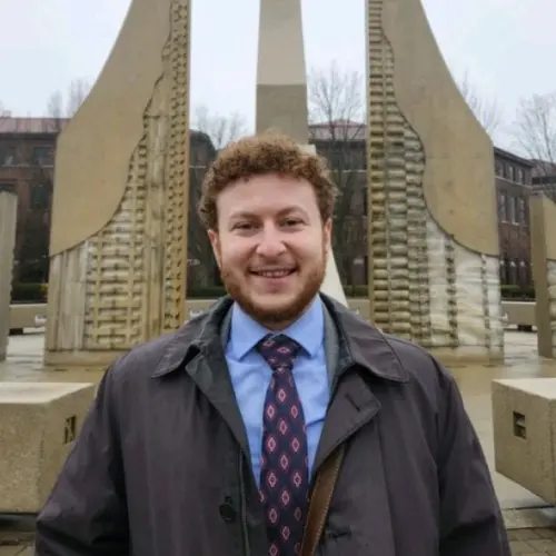 Alex Kling in a jacket and tie